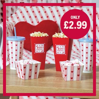 Movie night snack set with red heart-patterned popcorn tubs, drinks cups and treat boxes, Valentine’s themed display showing only £2.99 offer