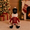 Festive Feeling Christmas Sitting Plush Nutcracker - Red